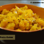 Aloo Gobhi served in an orange and brown bowl