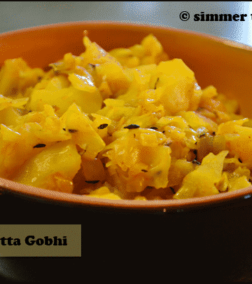 Aloo Gobhi served in an orange and brown bowl