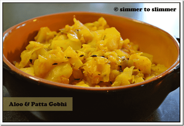 Aloo Gobhi served in an orange and brown bowl