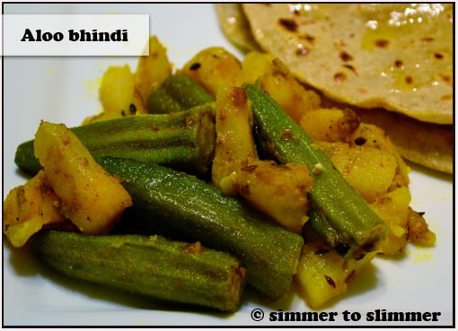Aloo Bhindi served with roti on a white plate