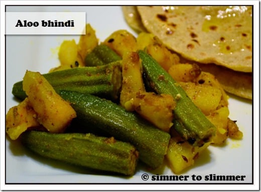 Aloo Bhindi served with roti on a white plate