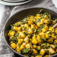 Aloo methi served in a black bowl