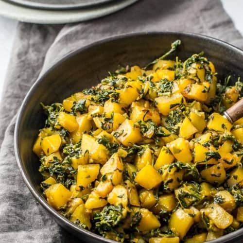 Aloo methi served in a black bowl