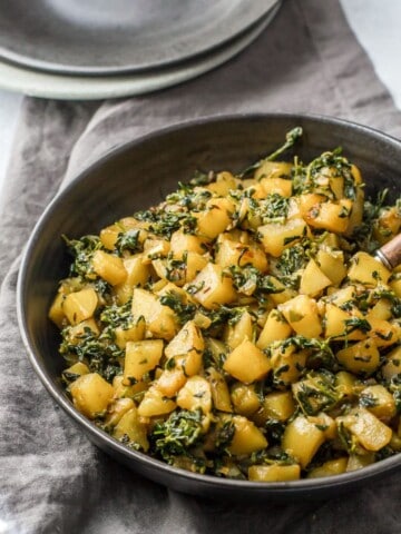 Aloo methi served in a black bowl