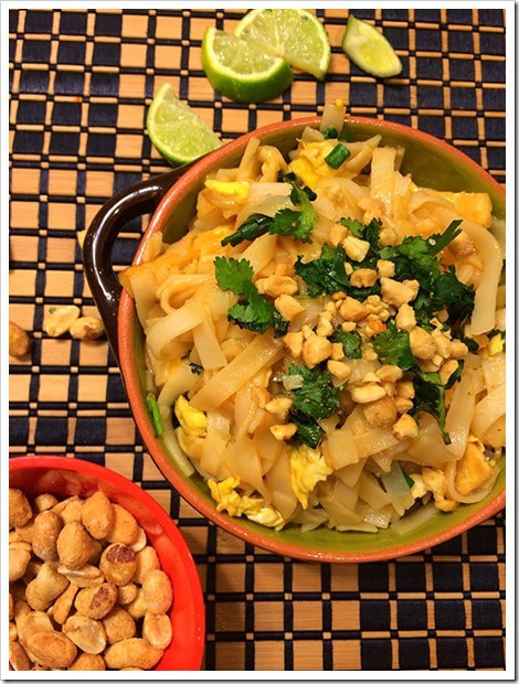 Pad thai served in a brown bowl