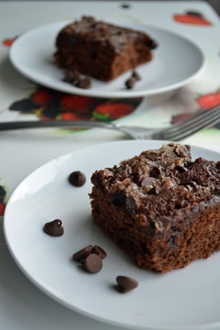 Chocolate cake served on two white plates