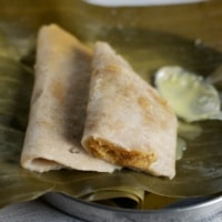 Gatti - rice dumplings stuffed with grated coconut and jaggery.