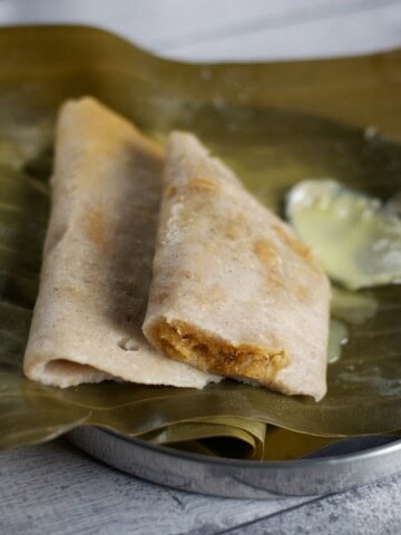 Gatti - rice dumplings stuffed with grated coconut and jaggery.