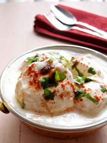 Dahi Vada served in a steel bowl