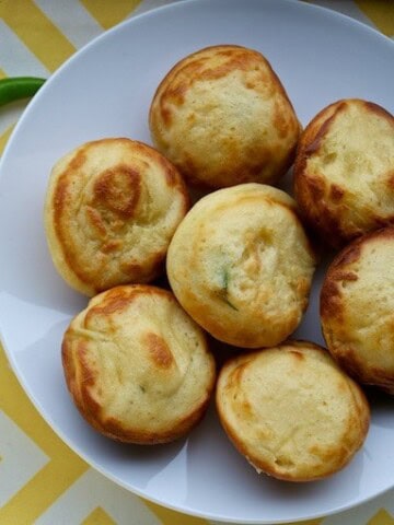 Goli Baje served in a white plate with green chili on the side