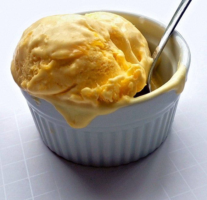 Mango ice cream served in a white bowl