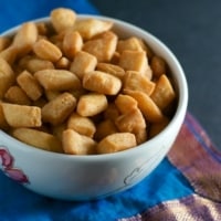 Shakarpara served in white bowl