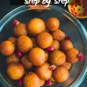 A glass bowl with balls of gulab jamun on a dark counter with the words Gulab Jamun Step by Step at the top.