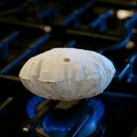 Puffed up roti on gas