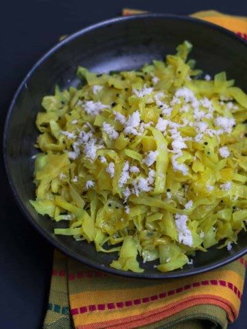 Cabbage Palya or Sukka Recipe - This simple, yet flavorful stir-fried cabbage preparation pairs well with steamed rice and sambar and makes for a perfect afternoon meal.