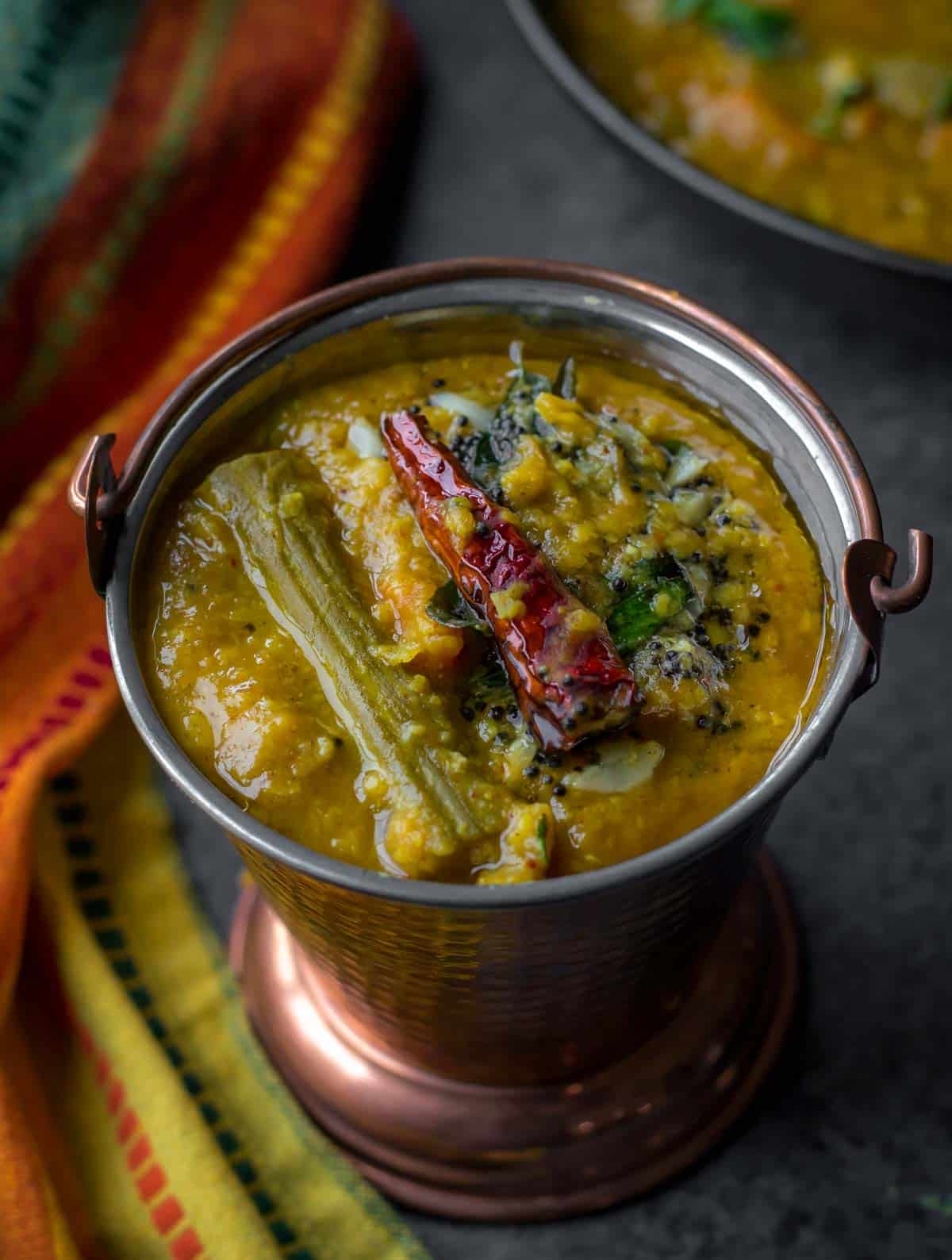 Sambar or Sambhar - Make this tangy and mildly spicy lentil-vegetable stew from the southern part of India and serve it alongside idlis or dosas for a wholesome breakfast. 