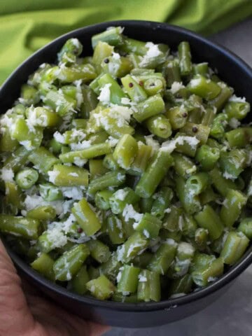 Beans poriyal served in a black bowl