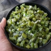 green beans poriyal served in a black bowl