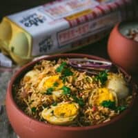 Egg biryani served in a brown bowl