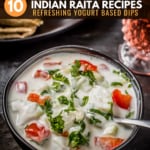 Cucumber tomato raita served in a black bowl and is accompanied by rotis and a glass of raspberry lemonade