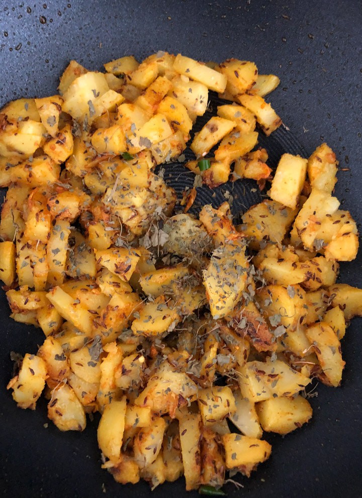 Cooked Aloo Jeera in a wok