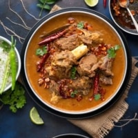 An overhead shot of Dal Gosht served with rice