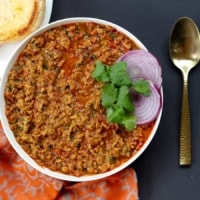 An overheat shot of Kheema served with Pav