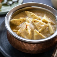 Shahi paneer in a copper bowl