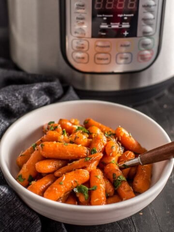 Instant Pot Honey glazed carrots served in a white bowl