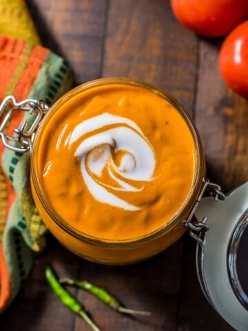 Overhead shot of Tikka Masala Sauce served in glass jar