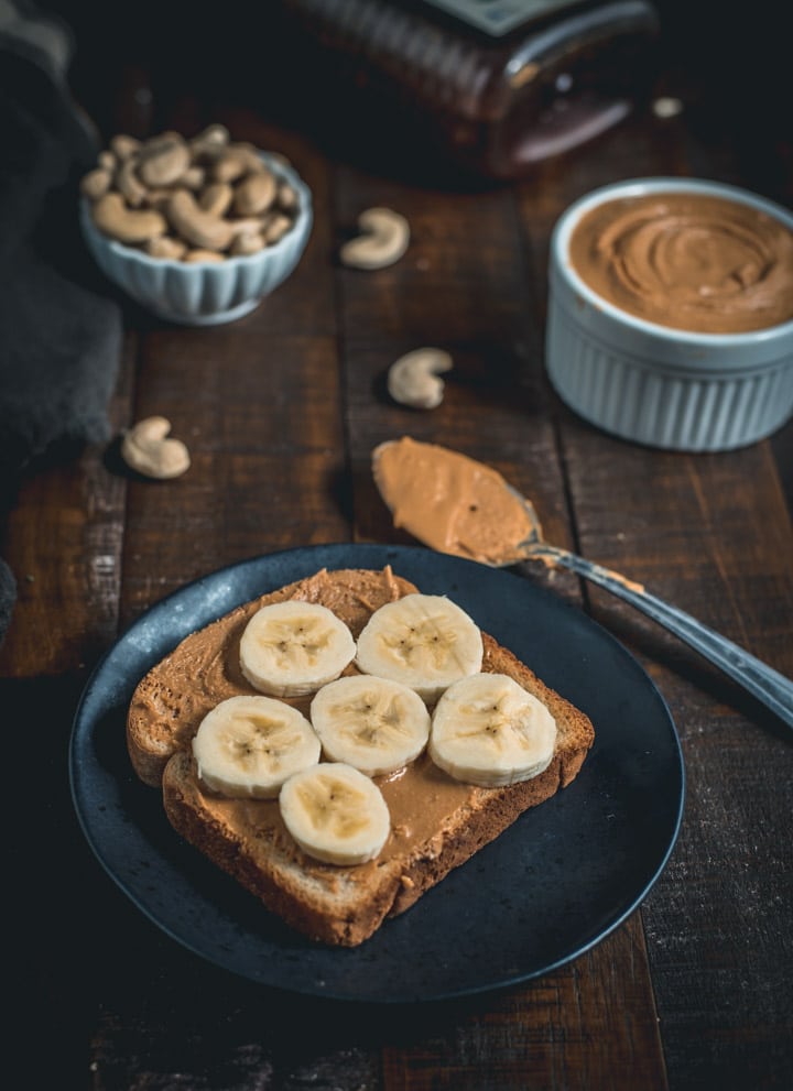 A toast spread with cashew butter and bananas on top