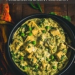A black bowl of creamy methi matar malai on a wooden table with the words Easy Methi Matar Malai Recipe with Paneer Fenugreek and Green Peas Curry at the top.