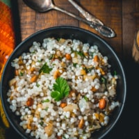 An overhead shot of Sabudana khichdi served in black bowl
