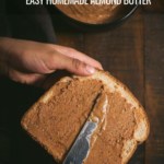 Spreading almond butter on a slice of bread