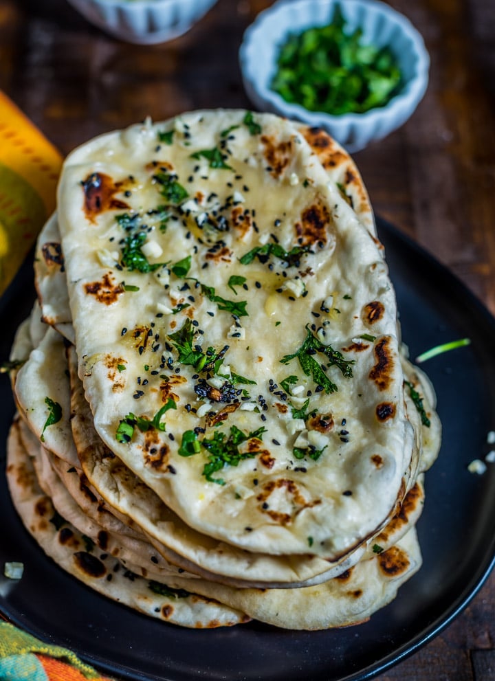 A stack of fresh naan bread.