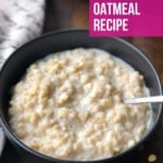 A black bowl with fresh oatmeal and a little milk on top with a spoon in the right of the bowl and a towel to the left of the bowl with the words Best Ever Instant Pot Oatmeal Recipe in the top right of the picture.