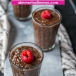 Three glassed filled with Chocolate Chia Pudding placed on a marble tray