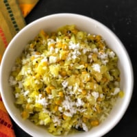 An overhead shot of cabbage kootu served in a white bowl