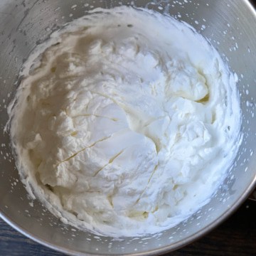 Whipped cream in a mixing bowl.