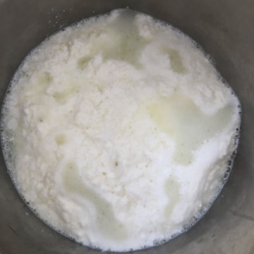 Milk and yogurt mixture cooling in the instant pot.