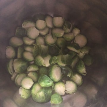 Brussel sprouts in the instant pot after steaming for 2 minutes.