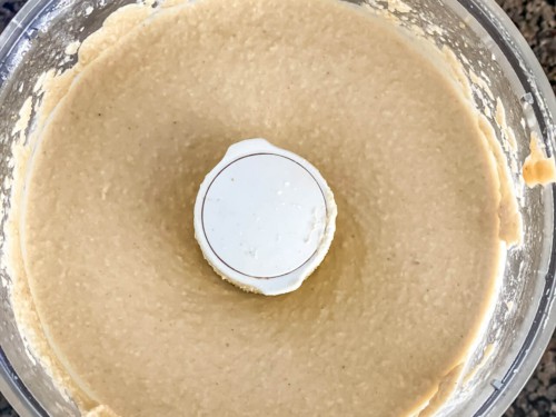 Creamy blended instant pot hummus in a food processor.