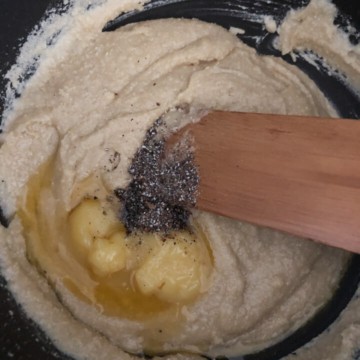 Ghee and cardamom powder added to cashew mixture