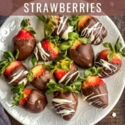 A white plate with chocolate dipped strawberries on a wooden counter with sprinkles and the words how to make chocolate covered strawberries at the top.