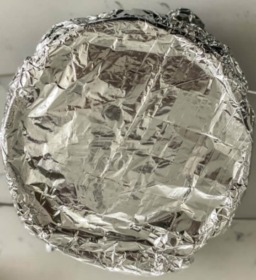 Foil on top of a springform pan with instant pot lasagna.