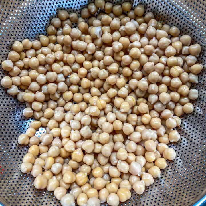 Drained chickpeas in a strainer.