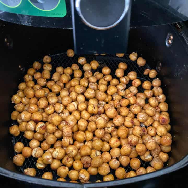 Air fryer roasted chickpeas in the air fryer after roasting.