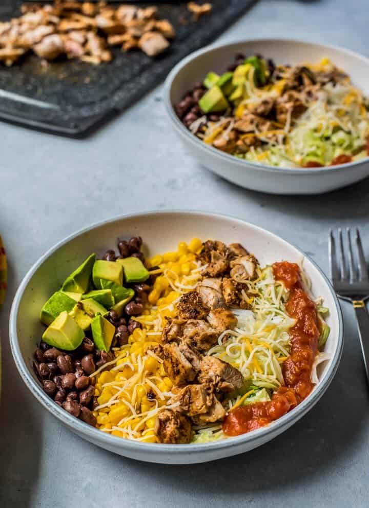 chipotle chicken burrito bowl in a white serving bowl for lunch or dinner