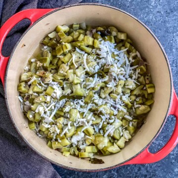 Turai garnished with coconut served in a red casserole