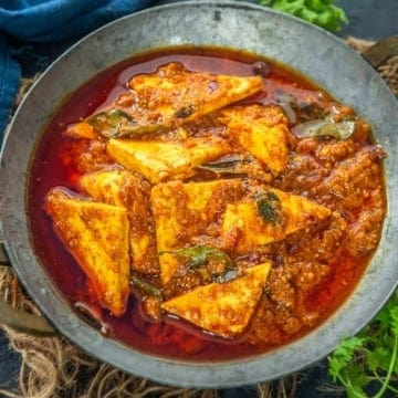 Paneer ghee roast served in a grey bowl